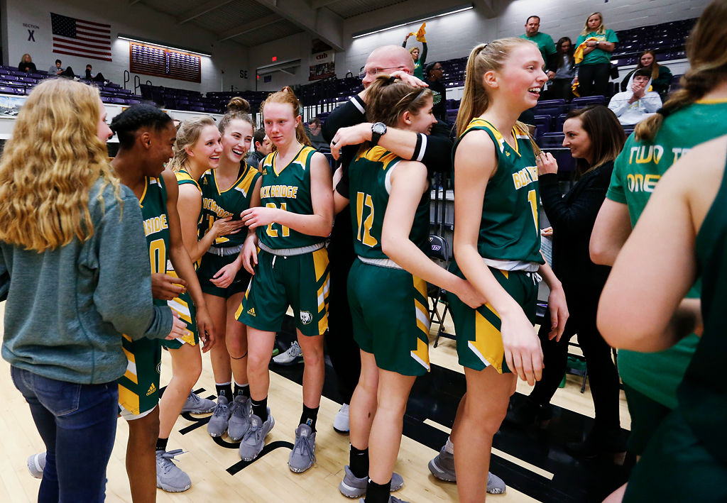 The Rock Bridge Bruins girls basketball team celebrates their win